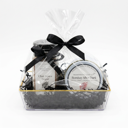 Gift set wrapped in clear cellophane with a black bow